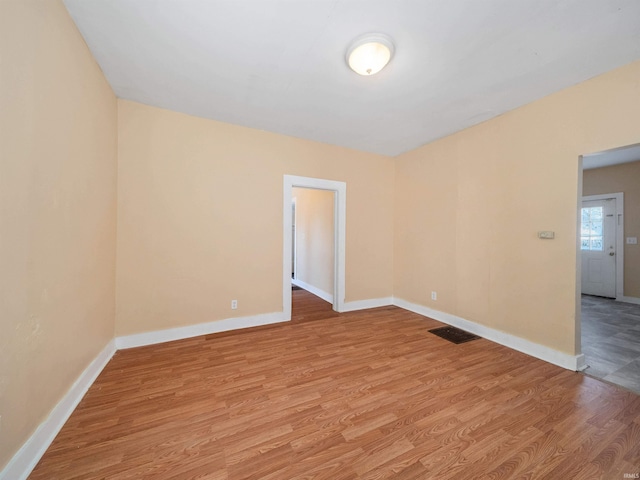 spare room featuring light hardwood / wood-style flooring