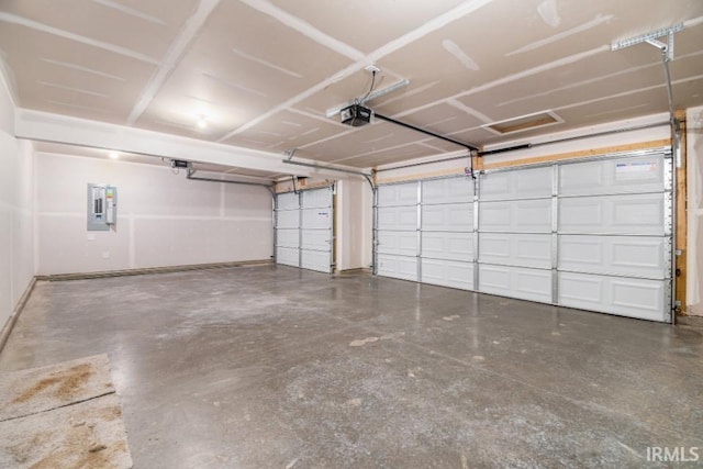 garage with electric panel and a garage door opener