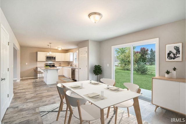 dining area featuring light hardwood / wood-style flooring