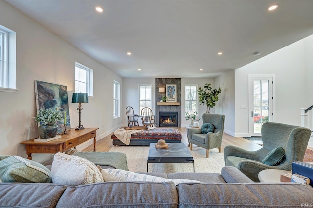 living room featuring a fireplace and light hardwood / wood-style flooring