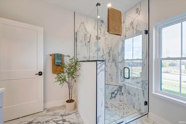 bathroom featuring an enclosed shower