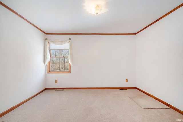 carpeted empty room featuring ornamental molding