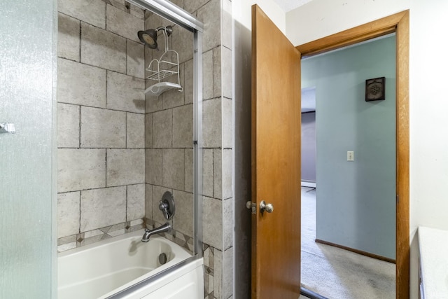 bathroom with baseboard heating and tiled shower / bath combo