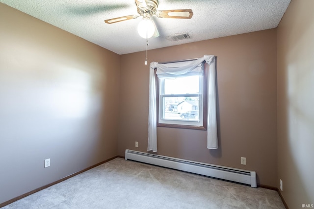 unfurnished room with ceiling fan, light colored carpet, a textured ceiling, and a baseboard heating unit