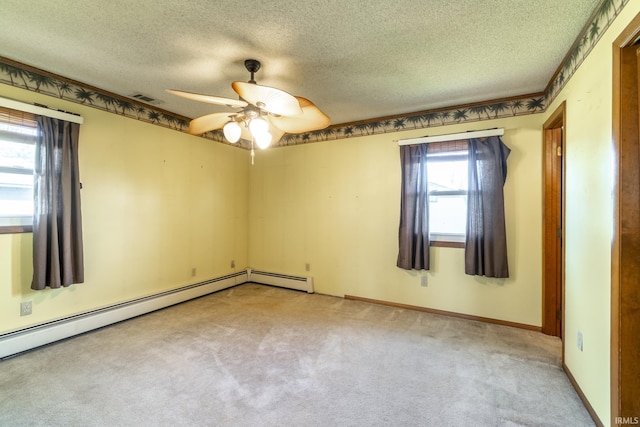 unfurnished room with ceiling fan, baseboard heating, a textured ceiling, and light carpet