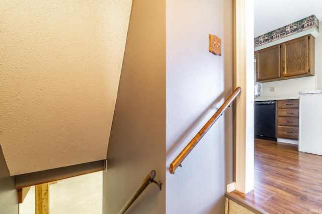 stairway featuring hardwood / wood-style flooring