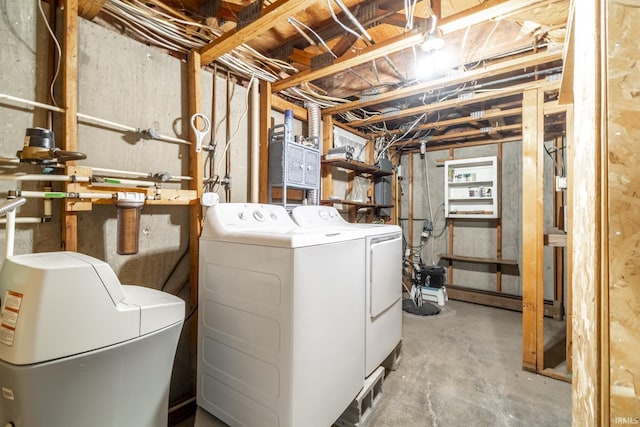 clothes washing area with independent washer and dryer