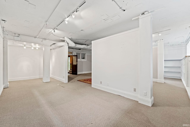 basement featuring light colored carpet