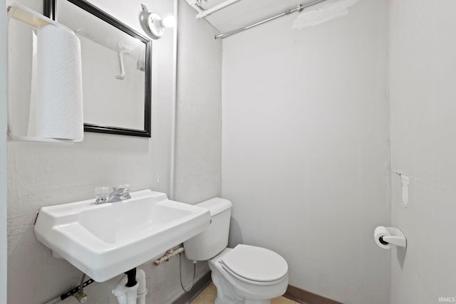 bathroom with sink and toilet