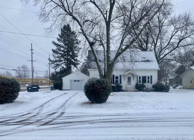 view of front of property featuring a garage and an outbuilding