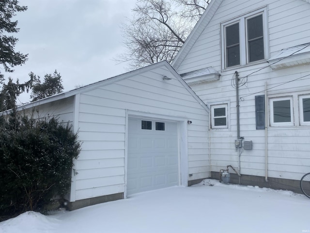 view of snow covered garage