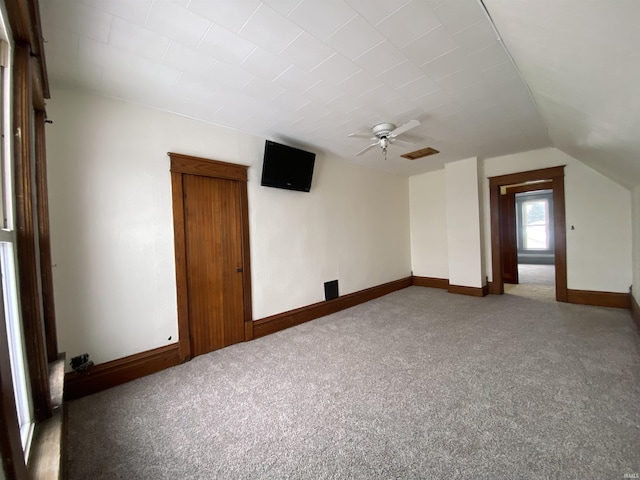 bonus room with ceiling fan, carpet, and lofted ceiling