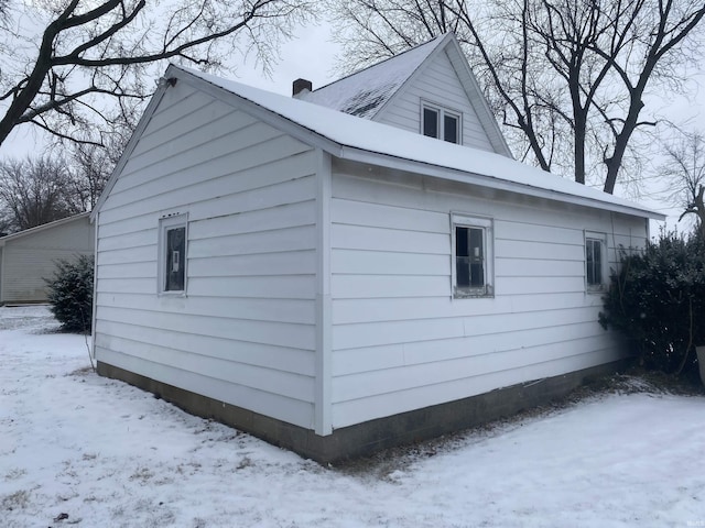 view of snow covered property