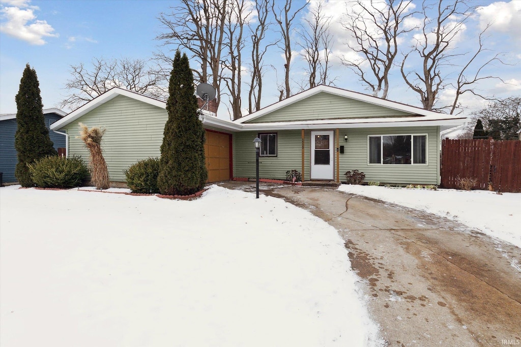 single story home featuring a garage