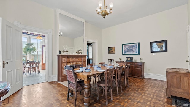 dining area featuring a notable chandelier