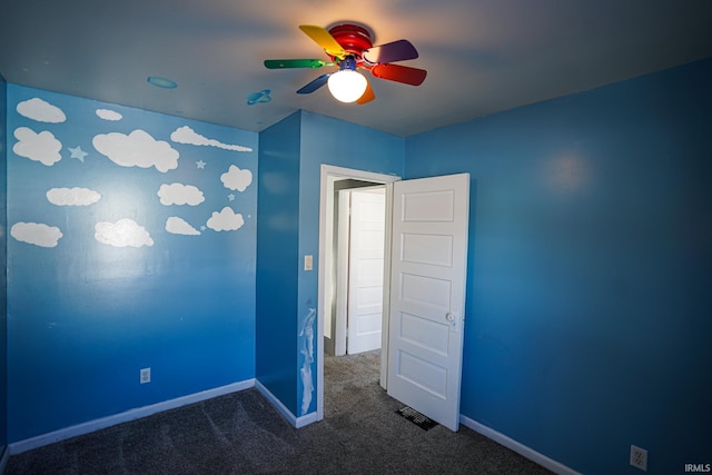 carpeted empty room with ceiling fan