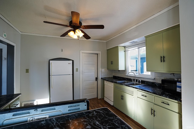 kitchen featuring crown molding, sink, tasteful backsplash, white appliances, and green cabinetry