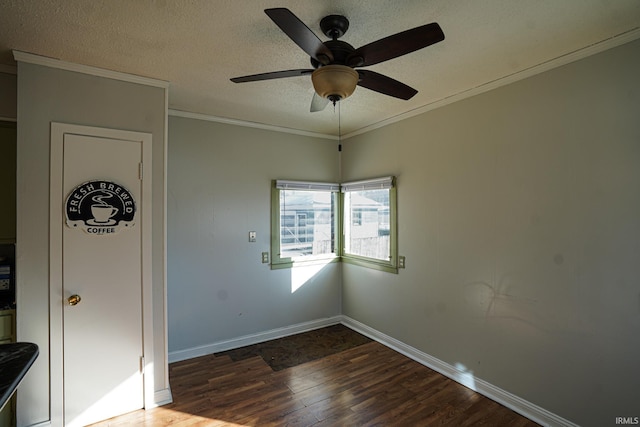 unfurnished room with dark hardwood / wood-style floors, ceiling fan, and ornamental molding