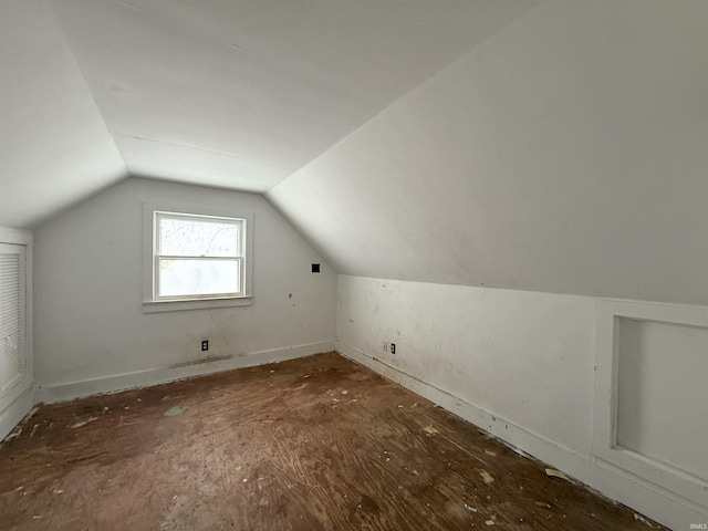 additional living space with vaulted ceiling