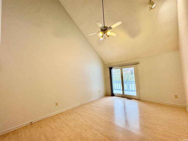 unfurnished room featuring ceiling fan, high vaulted ceiling, light hardwood / wood-style flooring, and a textured ceiling