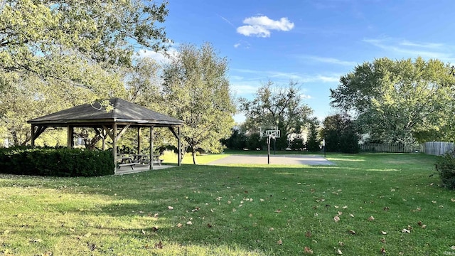 surrounding community with a patio, a gazebo, basketball court, and a lawn