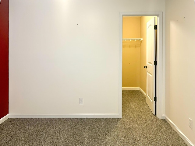 hallway featuring carpet flooring