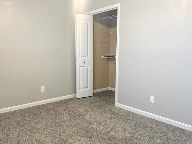 unfurnished bedroom with a closet and carpet