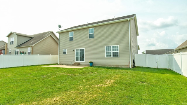 back of property featuring a patio area and a lawn