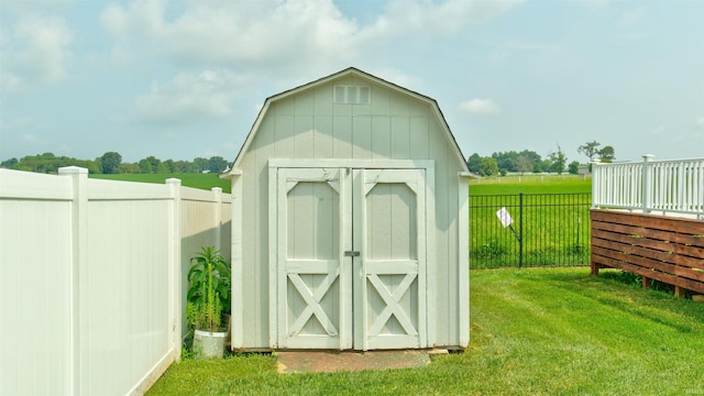 view of outbuilding with a lawn