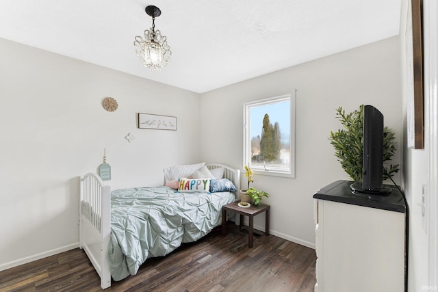 bedroom with dark wood-type flooring