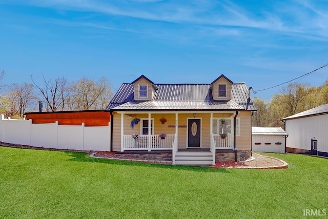 back of property with a porch and a yard