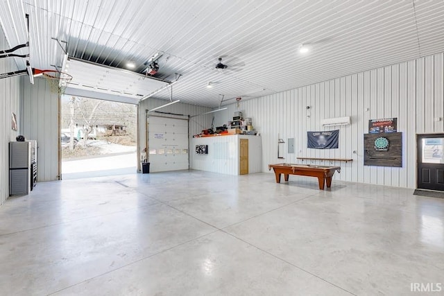 garage featuring wooden walls