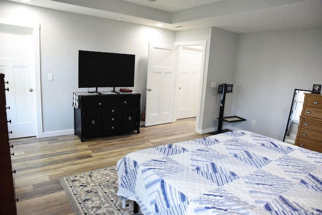 bedroom with hardwood / wood-style flooring