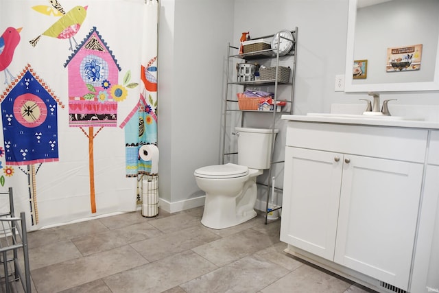 bathroom with toilet and vanity