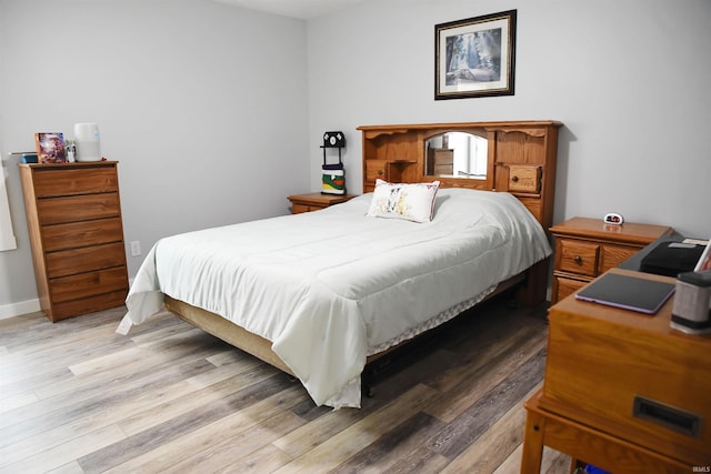 bedroom with light wood-type flooring