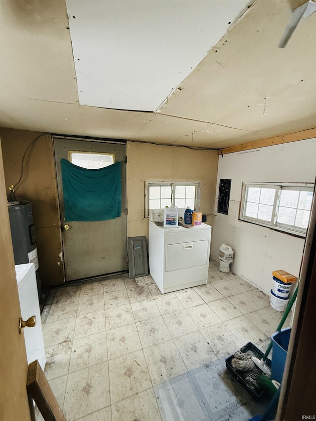 laundry area featuring water heater and washer / dryer