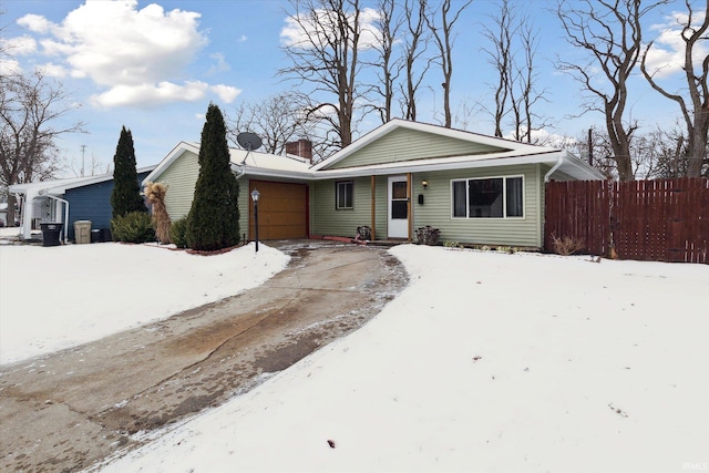 single story home with a garage