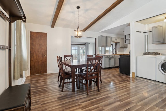 dining space with dark hardwood / wood-style flooring, french doors, vaulted ceiling with beams, washing machine and clothes dryer, and sink