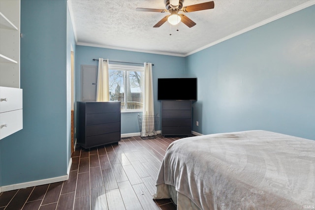 bedroom with ceiling fan, crown molding, and a textured ceiling