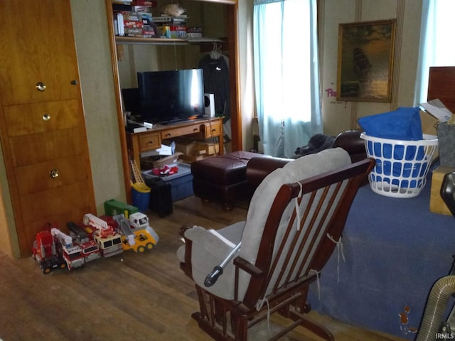 sitting room with hardwood / wood-style flooring