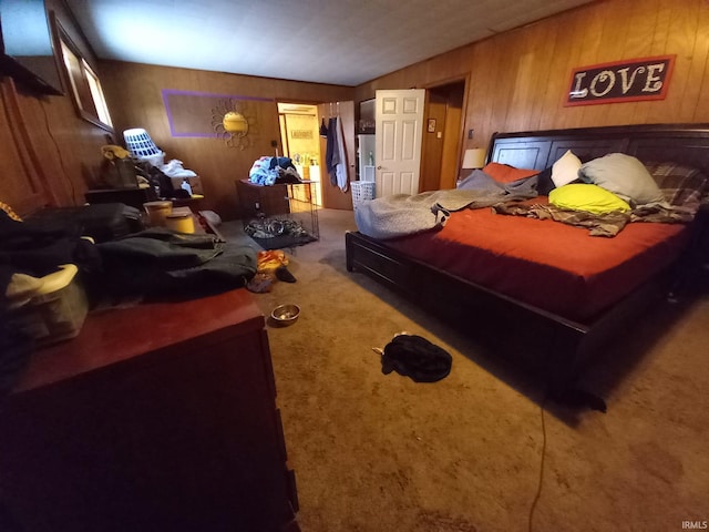 carpeted bedroom with wooden walls