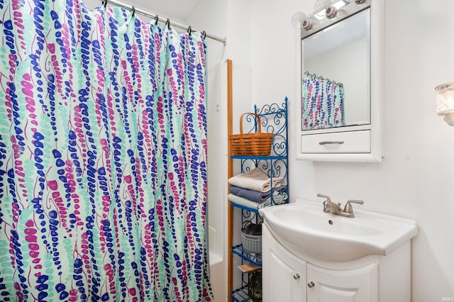 bathroom with vanity and curtained shower