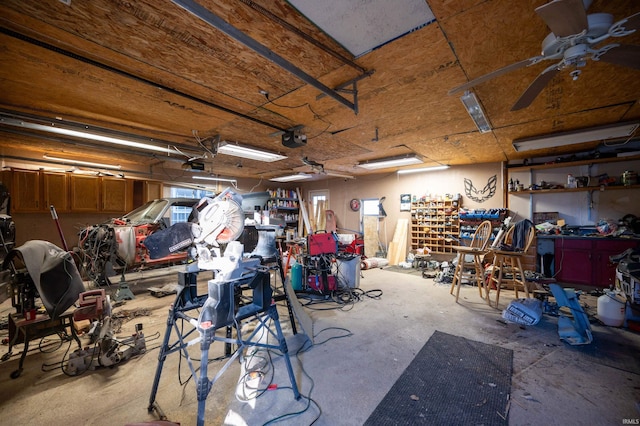 garage featuring a garage door opener and ceiling fan