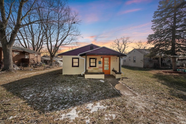 view of front of home with a lawn