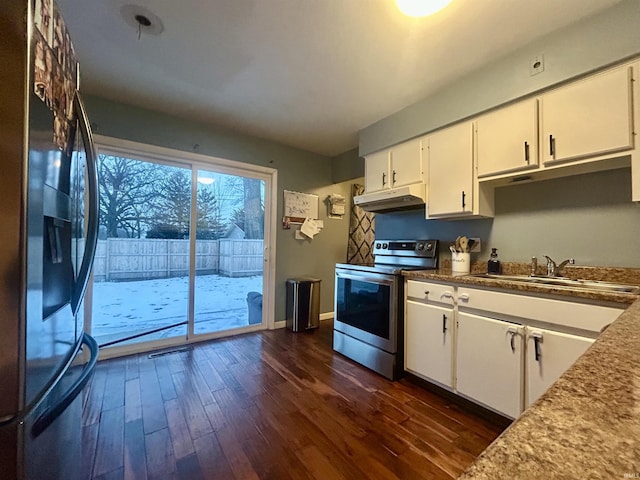 kitchen featuring dark wood-type flooring, appliances with stainless steel finishes, sink, and white cabinets