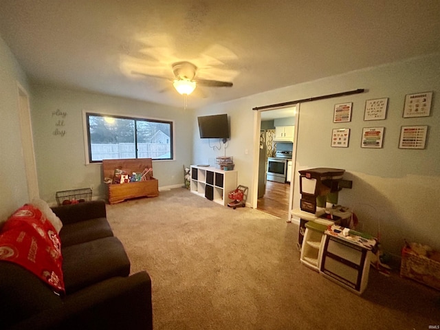 living room featuring ceiling fan and carpet