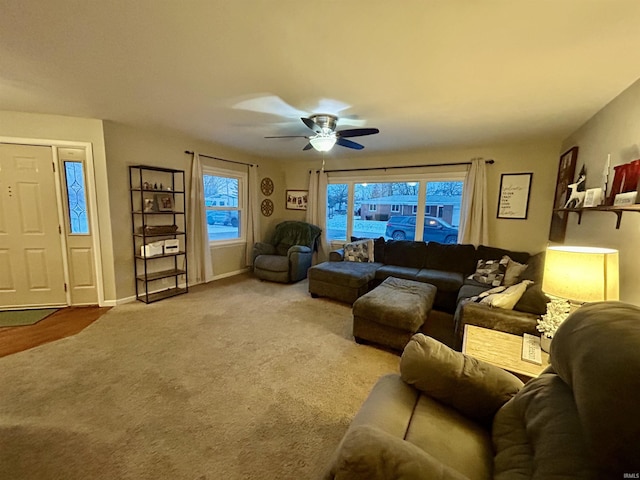 carpeted living room featuring ceiling fan