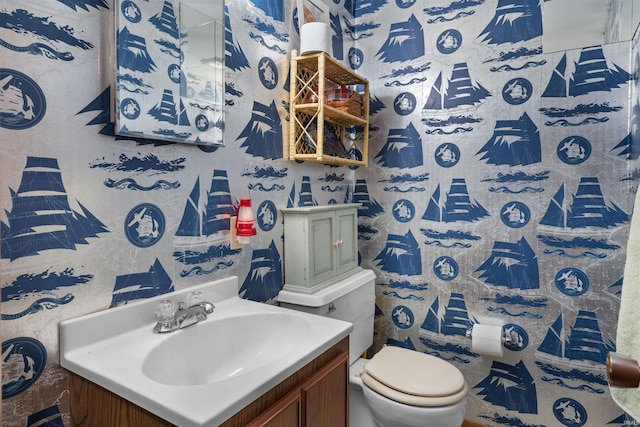 bathroom with vanity and toilet