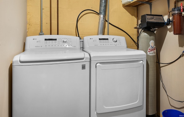 washroom with separate washer and dryer