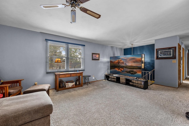 living room featuring ceiling fan and carpet